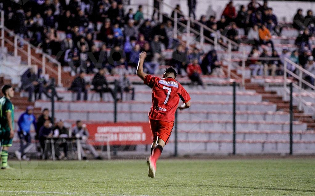 Running soccer player with his back